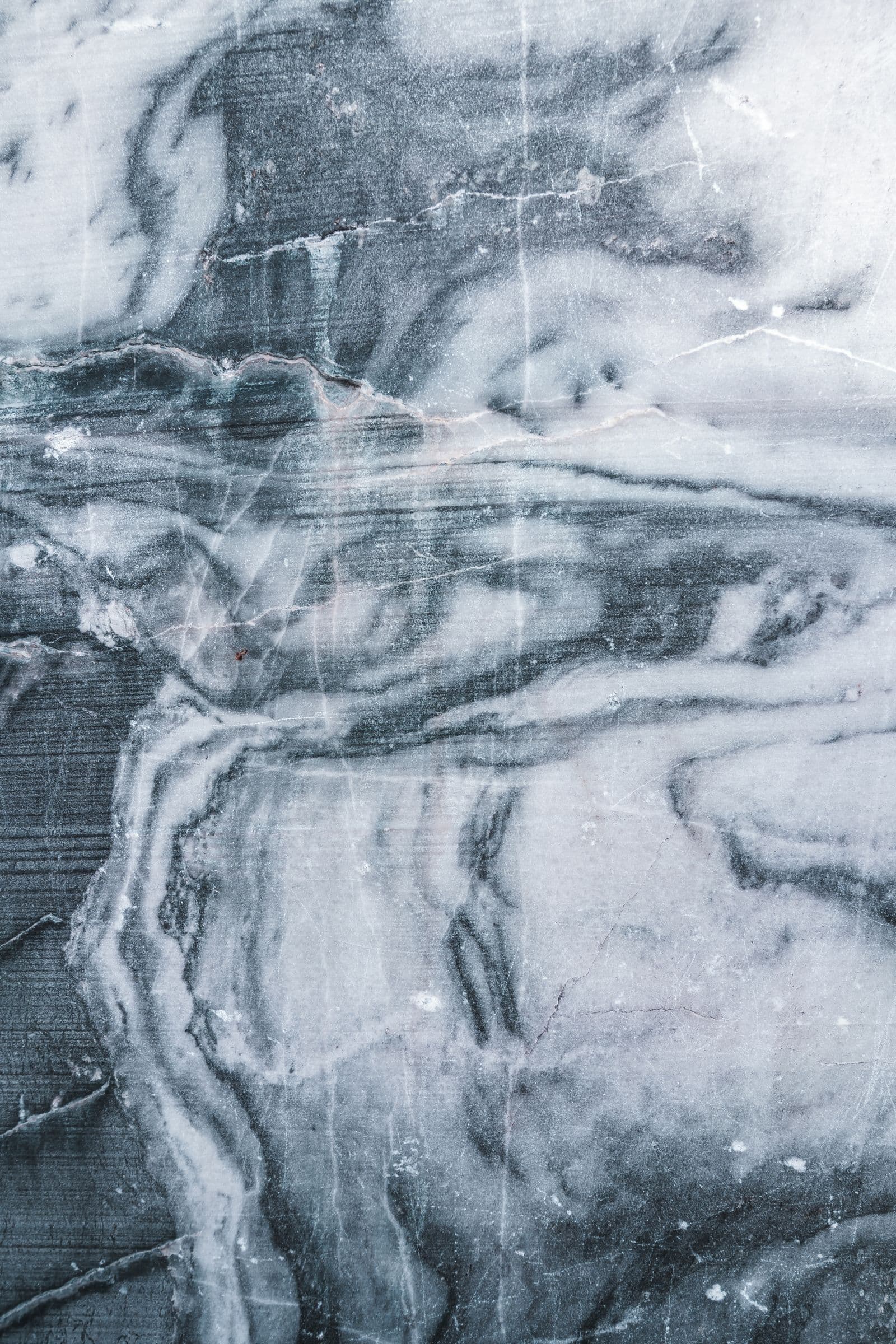 Polished gray marble surface with dramatic natural veining