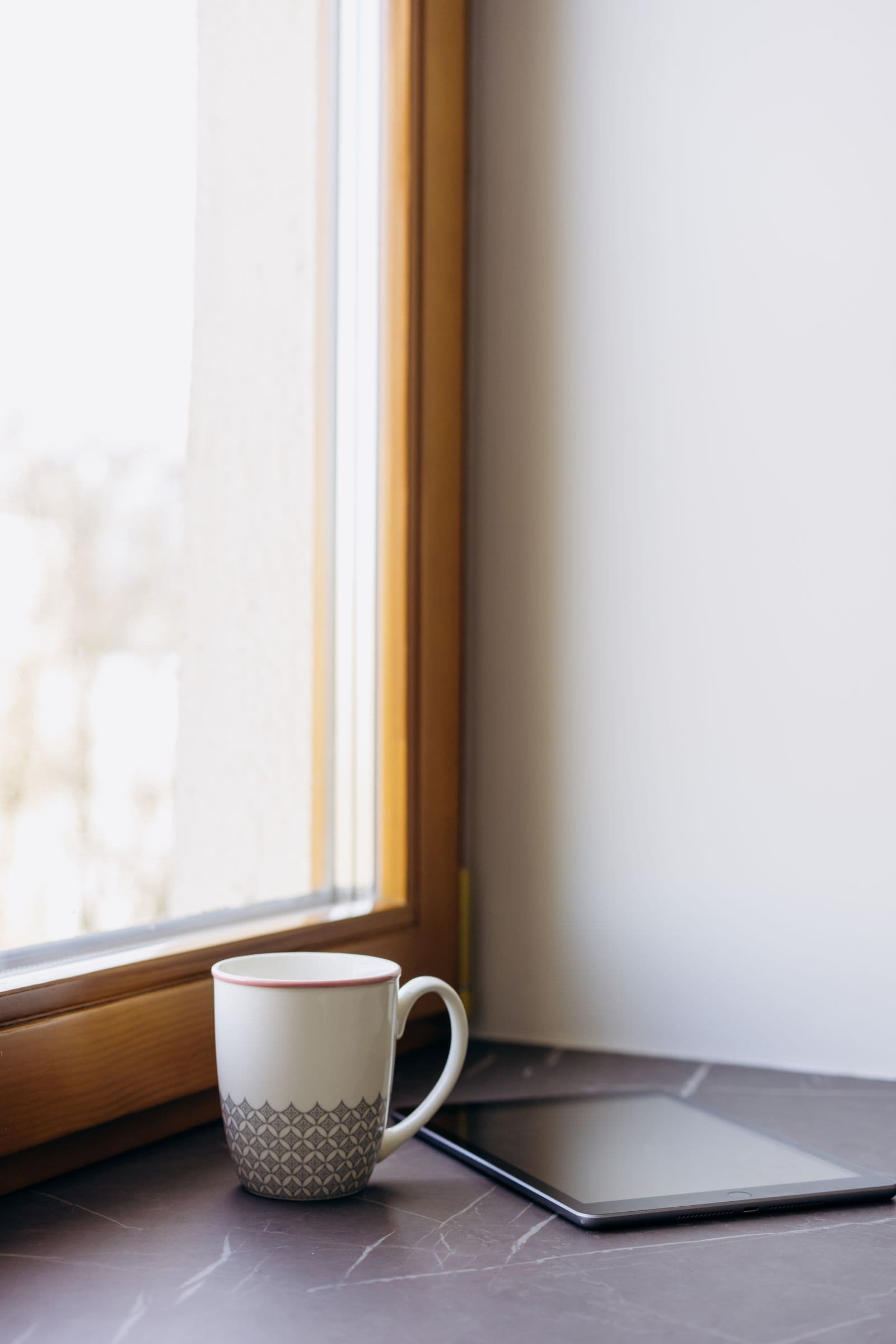 Dark stone window sill in warm morning light